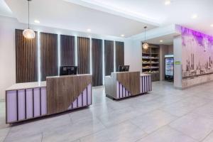 a lobby with two reception desks in a building at La Quinta Inn & Suites by Wyndham Texas City I 45 in Texas City