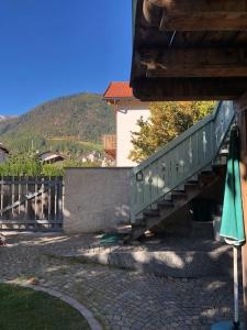 a stairway leading up to a building with a mountain at Villa Mathilde - Tirolese in Prato allo Stelvio