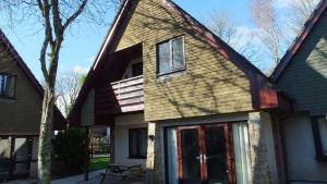 a house with a gambrel roof at 48 Trevithick Court, Tolroy Manor in Hayle