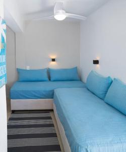 A bed or beds in a room at See the Sea 3