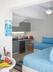 A kitchen or kitchenette at See the Sea 3