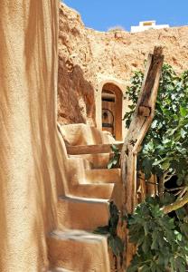 a set of stairs leading up to a building at Touring Club MARHALA MATMATA in Matmata