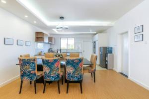 a kitchen and dining room with a table and chairs at Home Sweet Home in Nairobi