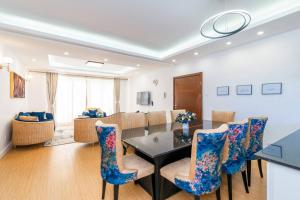 a dining room with a table and chairs at Home Sweet Home in Nairobi