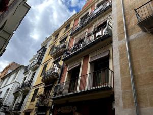 a building with balconies on the side of it at El negrito, apartamento centro in Valencia