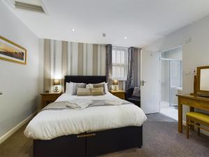 Кровать или кровати в номере The Beach House, Luxury Apartments