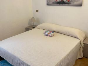 A bed or beds in a room at Apartment in Porto Pollo near Surf Paradise