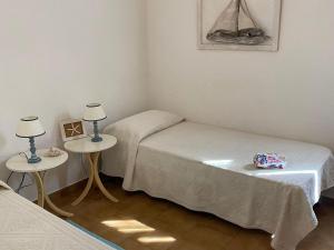 A bed or beds in a room at Apartment in Porto Pollo near Surf Paradise