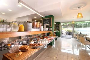 a breakfast buffet in a restaurant with a lot of food at Rezidence Vyšehrad in Prague