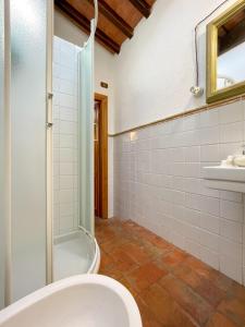 a bathroom with a shower and a toilet at Appartamento Beach & Tennis in Campo nell'Elba