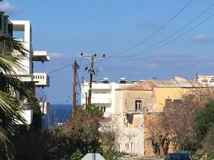 a view of a city with buildings on a street at Πολυτελές οροφοδιαμέρισμα για ονειρικές διακοπές! in Chania Town