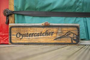 a sign that says orchestaater sitting on a table at Cherish Glamping in Askrigg