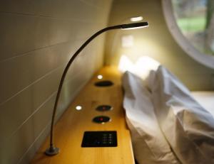 a lamp sitting on a table in a room at RiverBeds - Luxury Wee Lodges with Hot Tubs in Glencoe