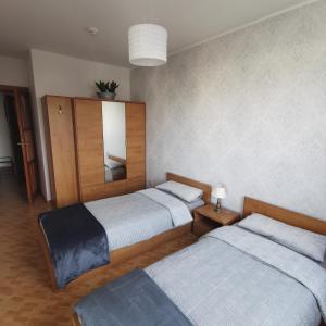 Posteľ alebo postele v izbe v ubytovaní Apartament nad morzem Diwa