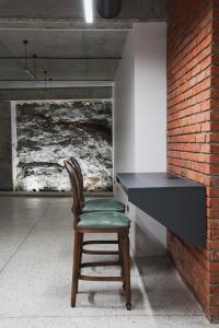 a chair sitting in front of a black desk at About Sololaki in Tbilisi City