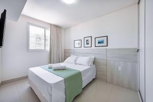 Ένα ή περισσότερα κρεβάτια σε δωμάτιο στο Apto maravilhoso a 200m da Praia das Castanheiras