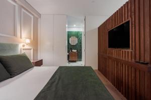 Postel nebo postele na pokoji v ubytování Brand New Apart Republic Square