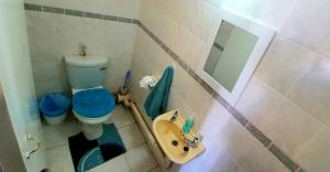 a bathroom with a toilet and a sink and a mirror at Calamari 11 - 6 Sleeper - 30 Steps From The Beach! in Margate +11 photos