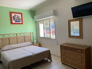 Letto o letti in una camera di Hotel Il Triangolo