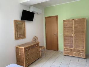 TV o dispositivi per l'intrattenimento presso Hotel Il Triangolo