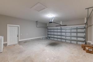 an empty room with white walls and a white door at Brand New Entire Home close to beach in Saint Augustine +53 photos