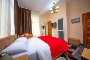Postel nebo postele na pokoji v ubytování Hotel Pik Loti