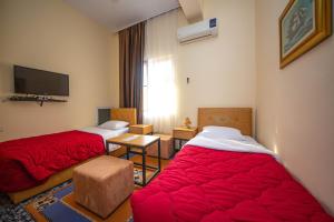 Postel nebo postele na pokoji v ubytování Hotel Pik Loti