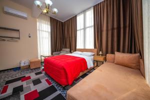 Postel nebo postele na pokoji v ubytování Hotel Pik Loti