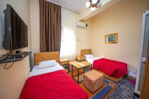 Postel nebo postele na pokoji v ubytování Hotel Pik Loti