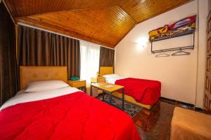 Postel nebo postele na pokoji v ubytování Hotel Pik Loti