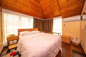 Postel nebo postele na pokoji v ubytování Hotel Pik Loti