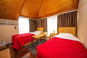 Postel nebo postele na pokoji v ubytování Hotel Pik Loti