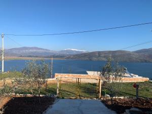 a gate with a view of a body of water at Villas Ermali in Ksamil