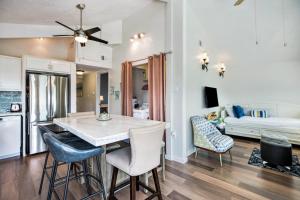 a kitchen and living room with a table and chairs at Bungalow by the Bay in Galveston
