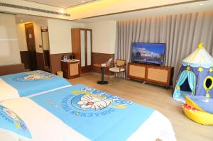 Postel nebo postele na pokoji v ubytování A Memory Hotel-Hotel in the Garden, Beijing Daxing International Airport, Beijing Aerospace Museum, Beijing Wildlife Park, Free daily necessities, Free night snack, Free laundry, English communication well, Free travel advice