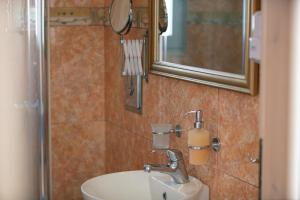 A bathroom at Evgoro Luxury Suites