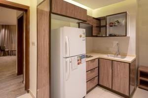 Kuchyň nebo kuchyňský kout v ubytování W Suites Hotel