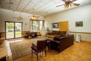 a living room with a couch and a table at Lafayette Inn in Moundsville