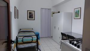 a room with two beds in the corner of a room at MINI HOUSE in Montescaglioso