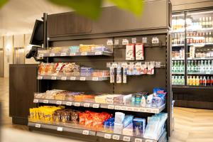 a grocery store aisle with food and drinks at The President Brussels Hotel in Brussels