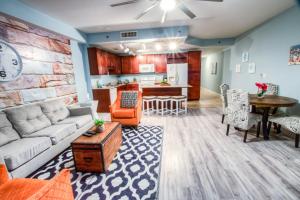 a living room with a couch and a table at Laketown Wharf Resort 416 By Aneliya in Panama City Beach +67 photos