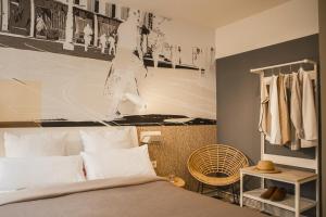 a bedroom with a bed with a basketball mural on the wall at room Select Tetuán in Seville