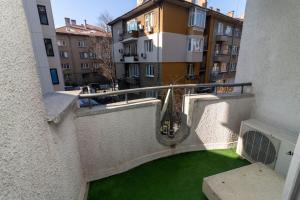 a view of a balcony with a green yard at Niko's 2 Bedroom Central Apartment in Sofia