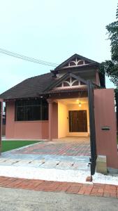 a house with a door in front of it at D Riad Ipoh Homestay l Home Cinema l 300MBPS in Ipoh