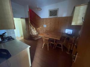 a kitchen with a wooden table and a dining room at Piana, Bologna by Short Holidays in Bologna +8 photos