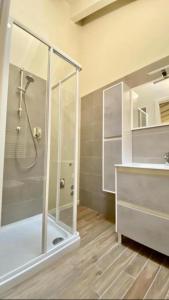 a bathroom with a shower and a sink at Savenella Apartments in Bologna