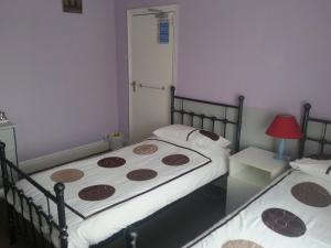 Postel nebo postele na pokoji v ubytování Arman Lodge House