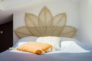 Кровать или кровати в номере Le Nid Azuré / Hypercentre
