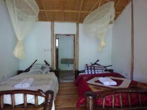 Ein Bett oder Betten in einem Zimmer der Unterkunft Nshongi Camp