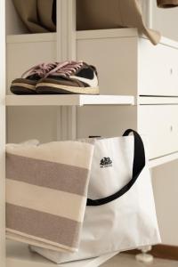 two towels on a shelf in a closet at Hotel Adriatica con Piscina in Riccione